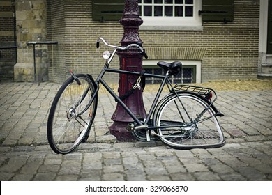 old-vintage-bike-broken-wheel-260nw-329066870.jpg